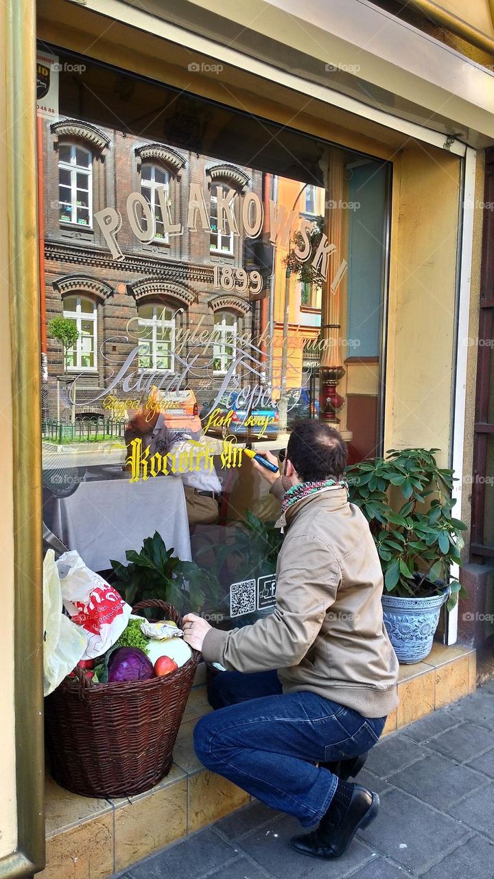 Man writing mirror reflection