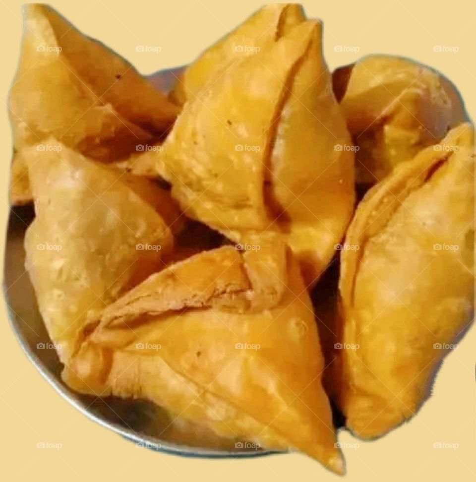 Enjoying breakfast in a restaurant. The most popular and favorite samosas.