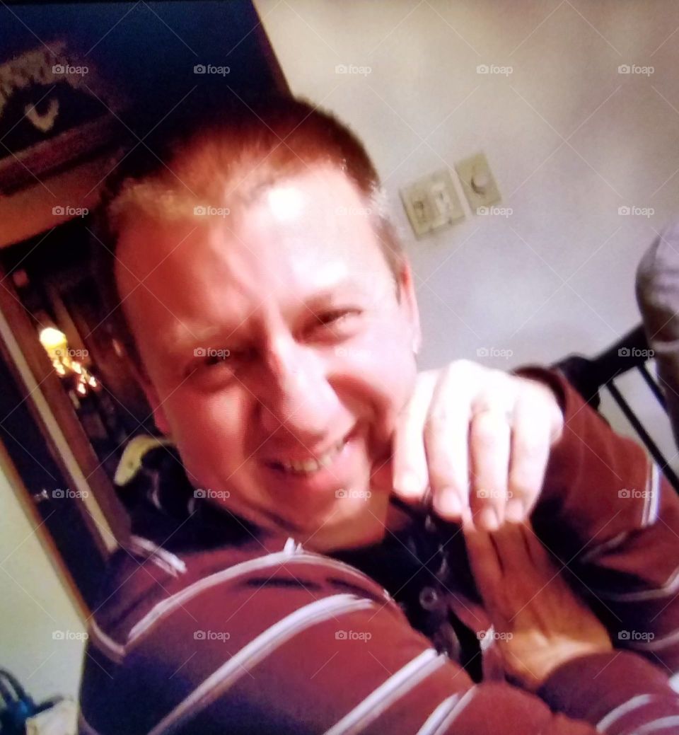 Facial expression of man smiling in closeup of happiness.