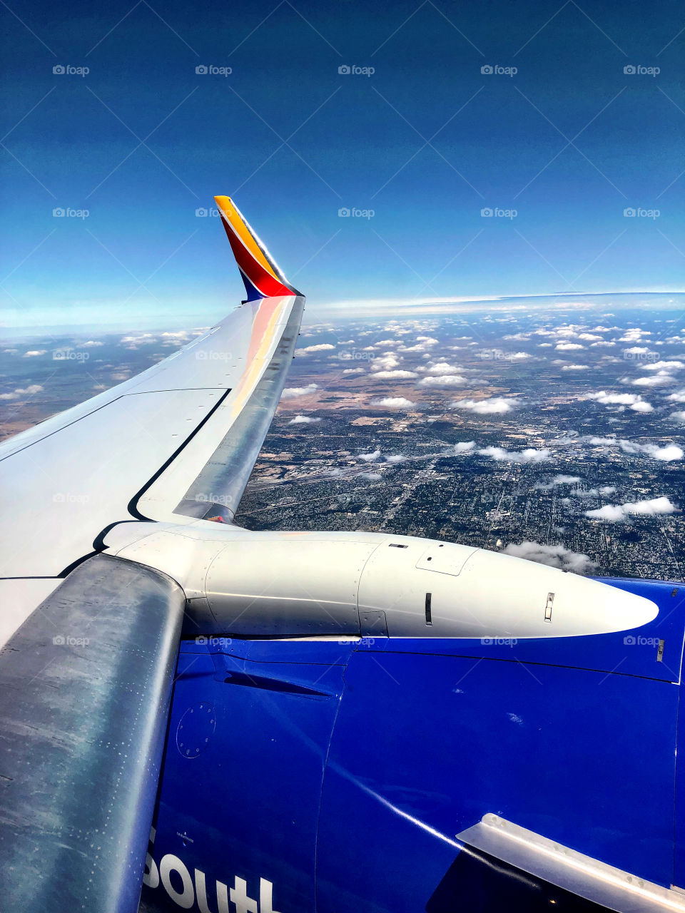 Southwest Airlines plane wing mid air 