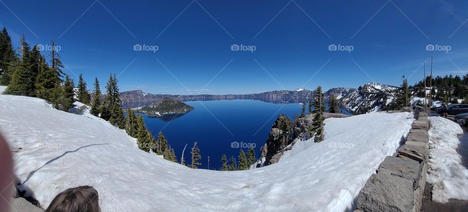 a beautiful view of Crater lake Oregon from the top of the mountain