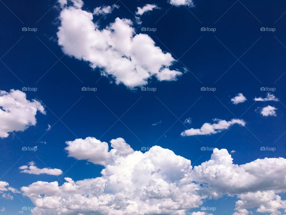 Blue skies with white clouds