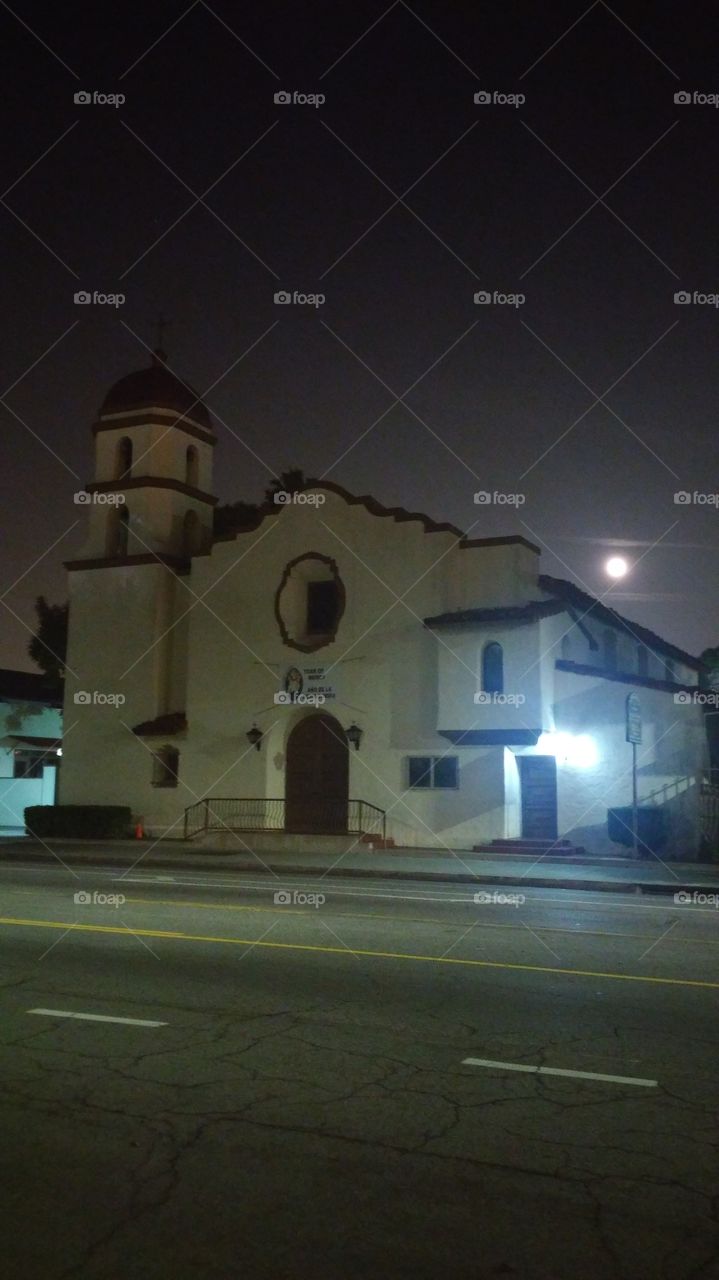 I'm not a fan of churches, but I Am a fan of their architecture and design.  Some churches (or other places of worship) stand out than others, to me, especially when the moon is out behind it. Even with that artificial light to side, I thought it was nice.