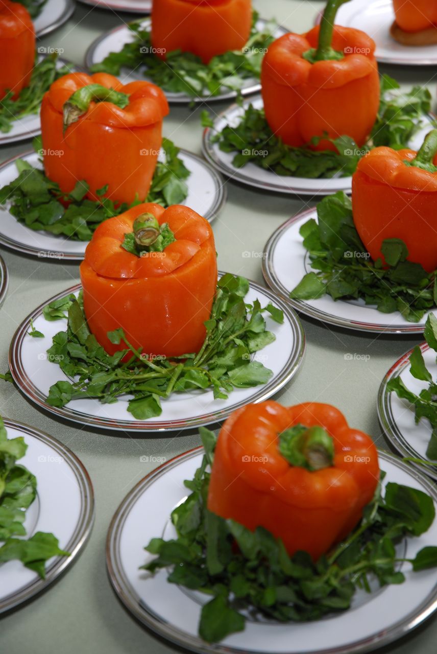 Beautiful orange peppers plated up for squash soup vessels
