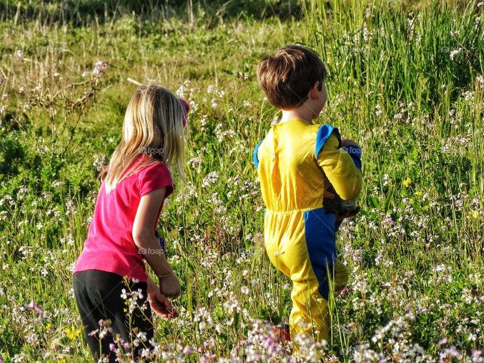 Children In Field Of Wildflowers
