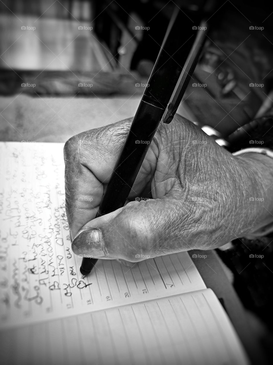 Old lady shaking hand writing