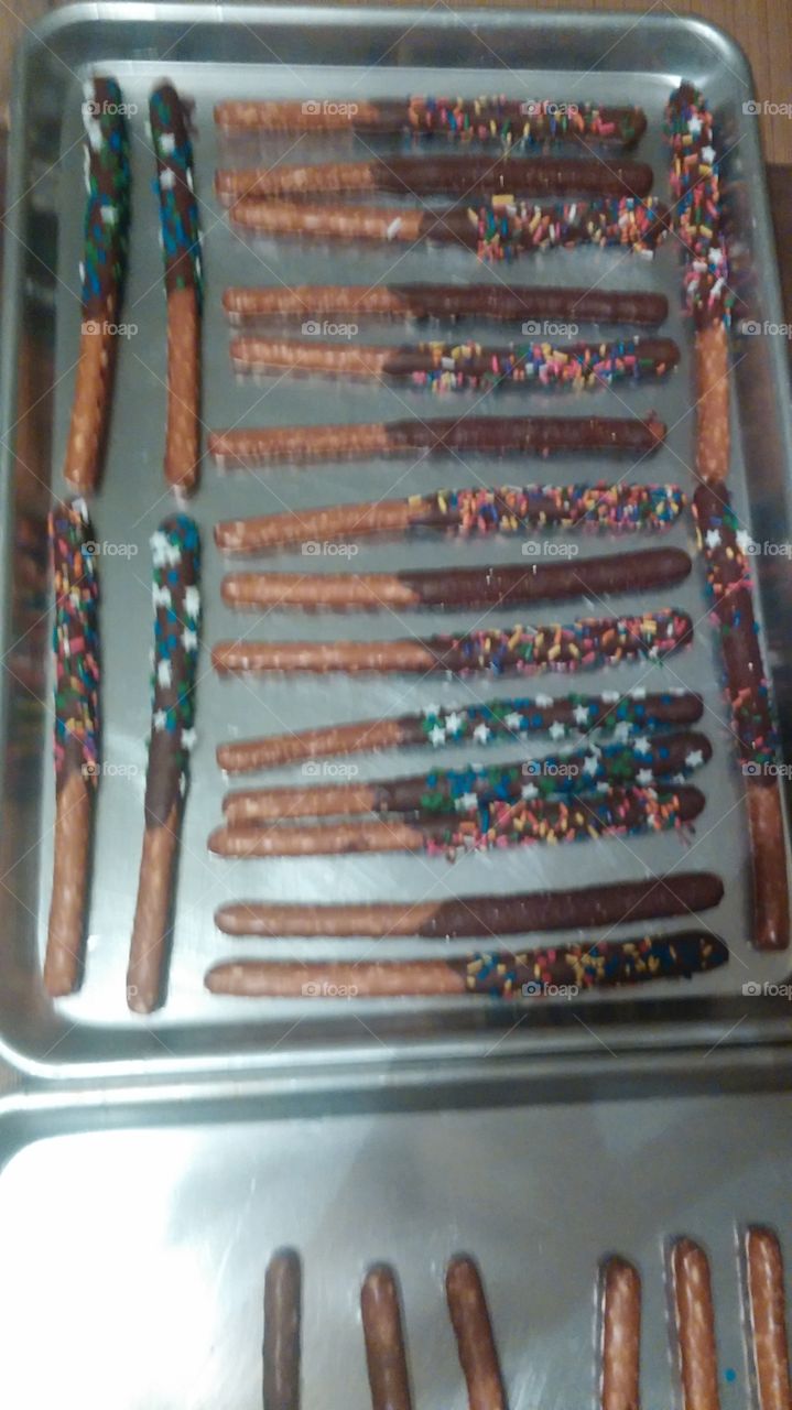 pretzels covered in chocolate and sprinkles