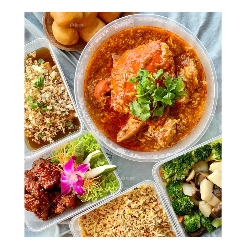 Asian local dishes in tze char style, Chilli crab, coffee pork ribs, caipo beancurd, broccoli with scallops and classic fried rice 