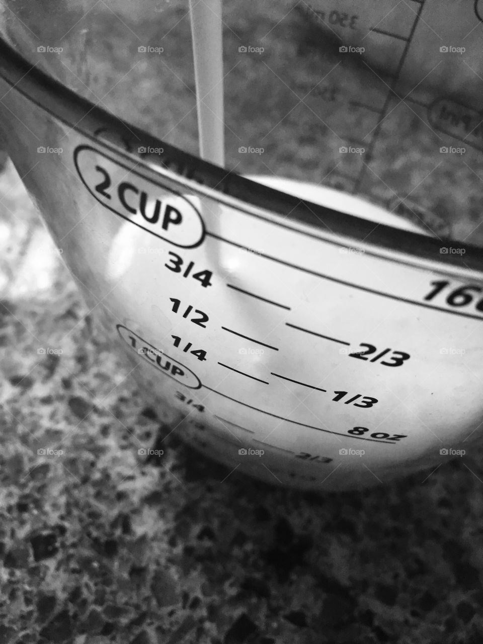 Milk being poured into a Measuring Cup  (for baking).