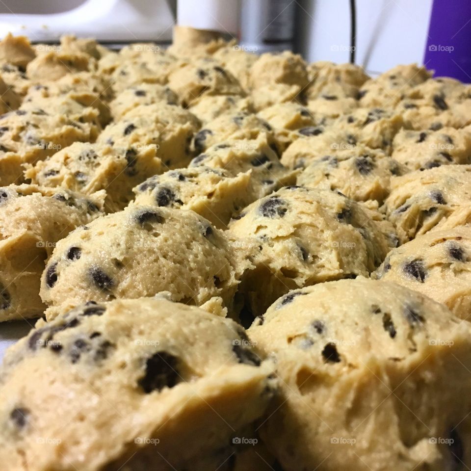 Close up of one of the many tray fulls of chocolate chip cookie dough I make daily