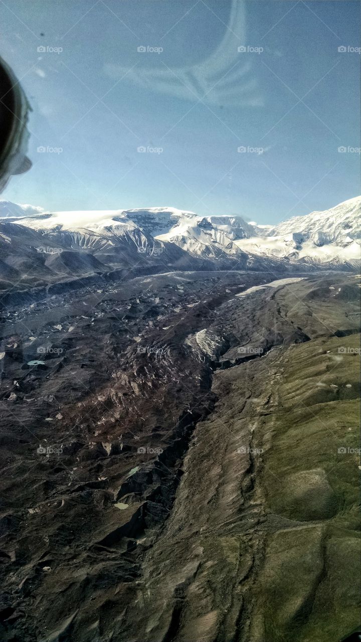 Flying over Moraine flow off glaciers of Mt. Stanford