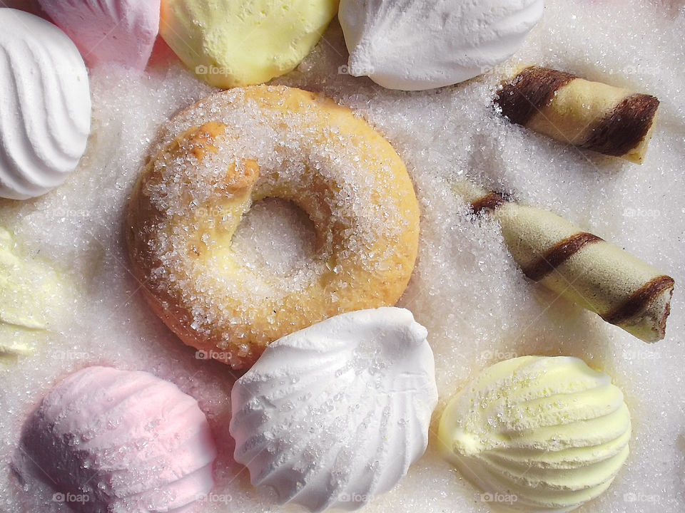 Candies and cookies in white sugar 