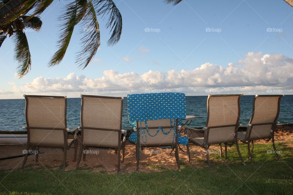 Beach Chairs by the Ocean. A relaxing day as the sun is about to set on the North Shore of Oahu, Hawaii.