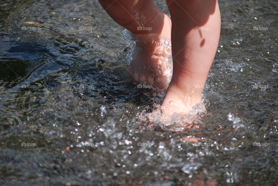 Childs feet in water