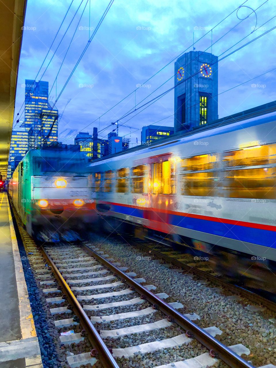 Waiting for a train that is just arriving in the railway station