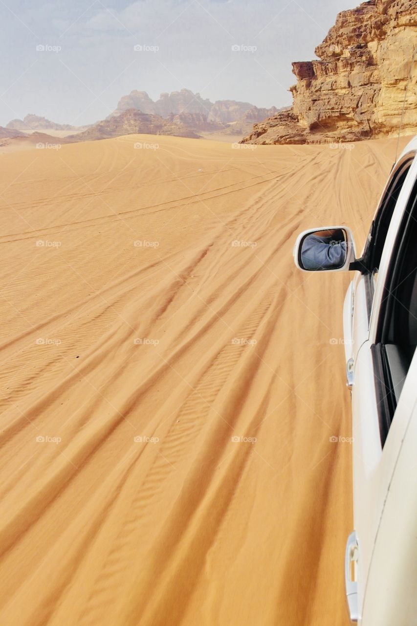 A Jeep cruising on a desert 