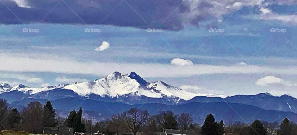 View of snow capped mts. from Hwy. #121 between Broomfield & Lafayette, Co.