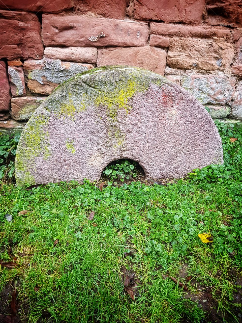 Old broken millstone
