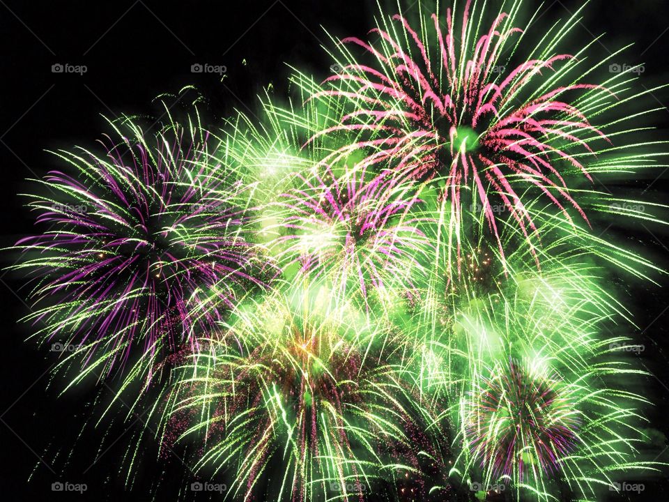 Fireworks in green and pink