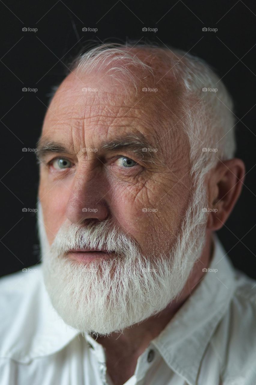 Portrait of an adult, emotions, wrinkles and the history of a person’s life in one portrait. Unique face skin stories