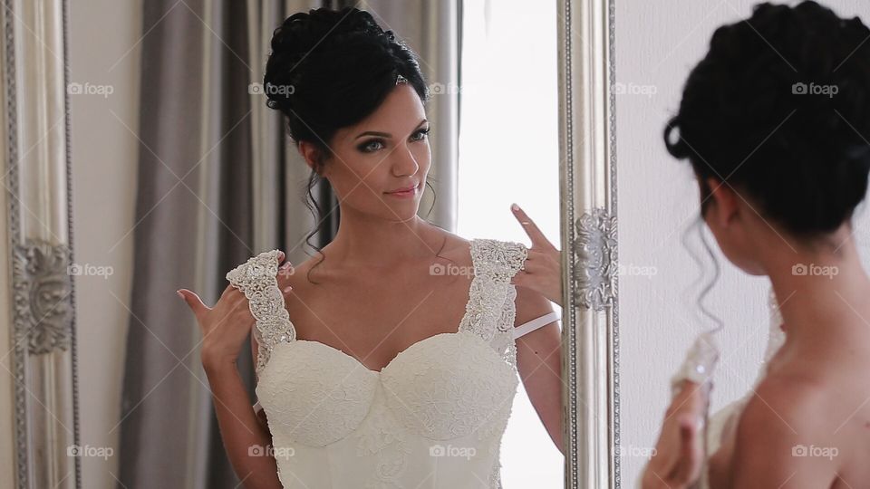 Bride near mirror 