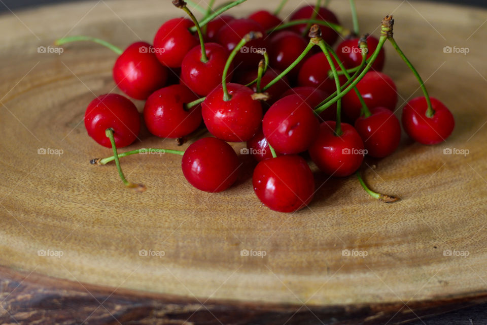 cherries on wood board