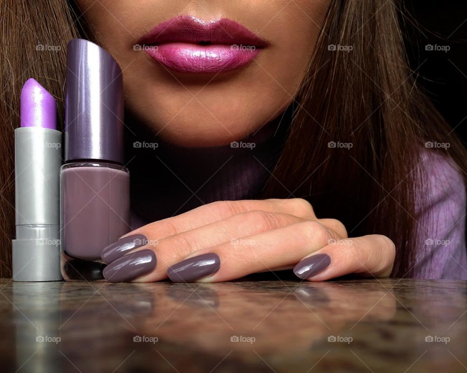 Purple lipstick and nail polish 