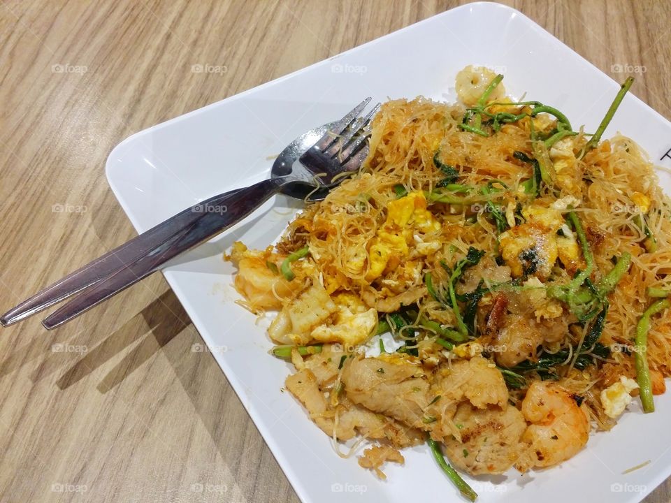 Fried pork noodles, squid, shrimp, food Thailand.