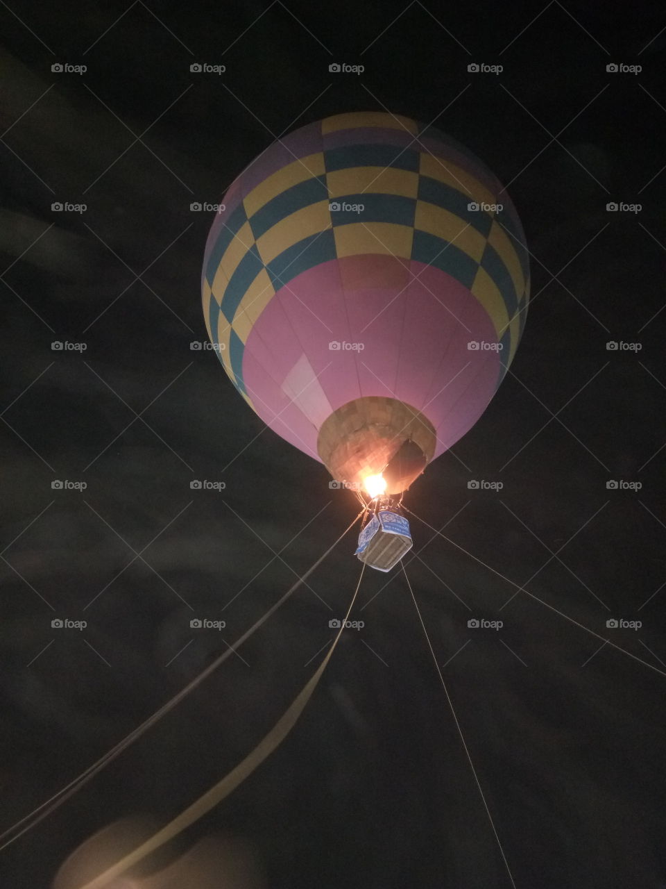 A hot air balloon is a lighter than air aircraft consisting of a bag, called an envelope, which contains heated air. Suspended beneath is a gondola or wicker basket (in some long-distance or high-altitude balloons, a capsule), which carries passengers and (usually) a source of heat, in most cases an open flame. The heated air inside the envelope makes it buoyant since it has a lower density than the colder air outside the envelope. As with all aircraft, hot air balloons cannot fly beyond the atmosphere. Unlike gas balloons, the envelope does not have to be sealed at the bottom, since the air near the bottom of the envelope is at the same pressure as the surrounding air. In modern sport balloons the envelope is generally made from nylon fabric and the inlet of the balloon (closest to the burner flame) is made from a fire resistant material such as Nomex. Modern balloons have been made in all kinds of shapes, such as rocket ships and the shapes of various commercial products, though the traditional shape is used for most non-commercial, and many commercial, applications.

The hot air balloon is the first successful human-carrying flight technology. The first untethered manned hot air balloon flight was performed by Jean-François Pilâtre de Rozierand François Laurent d'Arlandes on November 21, 1783, in Paris, France,[1] in a balloon created by the Montgolfier brothers.[2] The first hot-air balloon flown in the Americas was launched from the Walnut Street Jail in Philadelphia on January 9, 1793 by the French aeronaut Jean Pierre Blanchard.[3] Hot air balloons that can be propelled through the air rather than simply drifting with the wind are known as thermal airships.
A hot air balloon is a lighter than air aircraft consisting of a bag, called an envelope, which contains heated air. Suspended beneath is a gondola or wicker basket (in some long-distance or high-altitude balloons, a capsule), which carries passengers and (usually) a source of heat, in most cases an open..