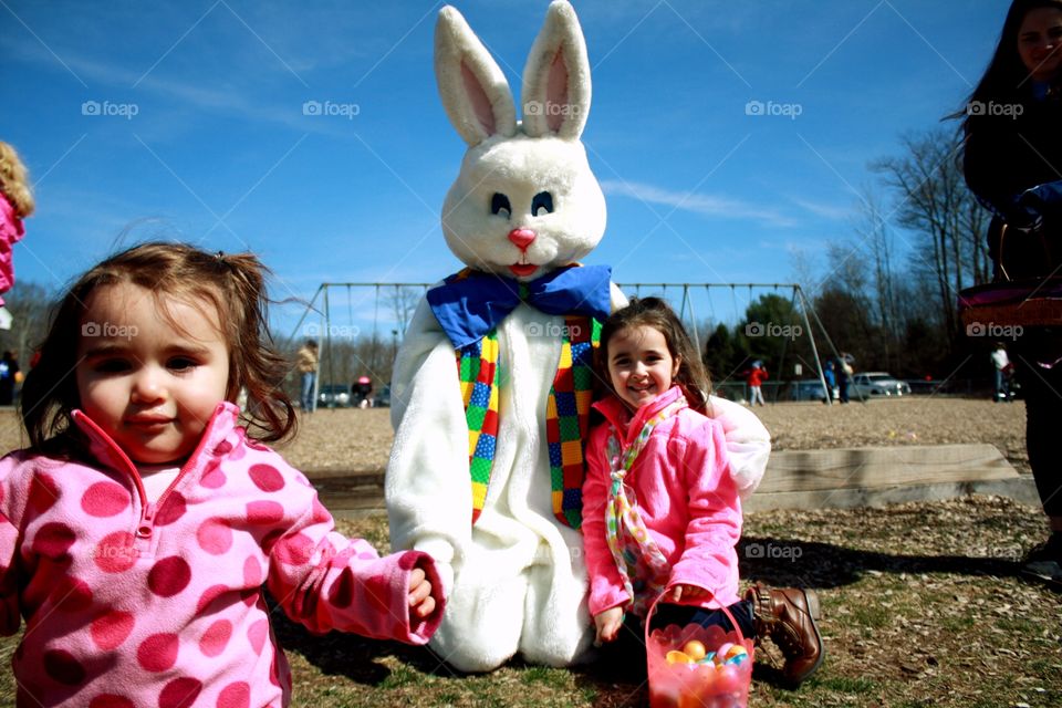 Two sisters with bunny