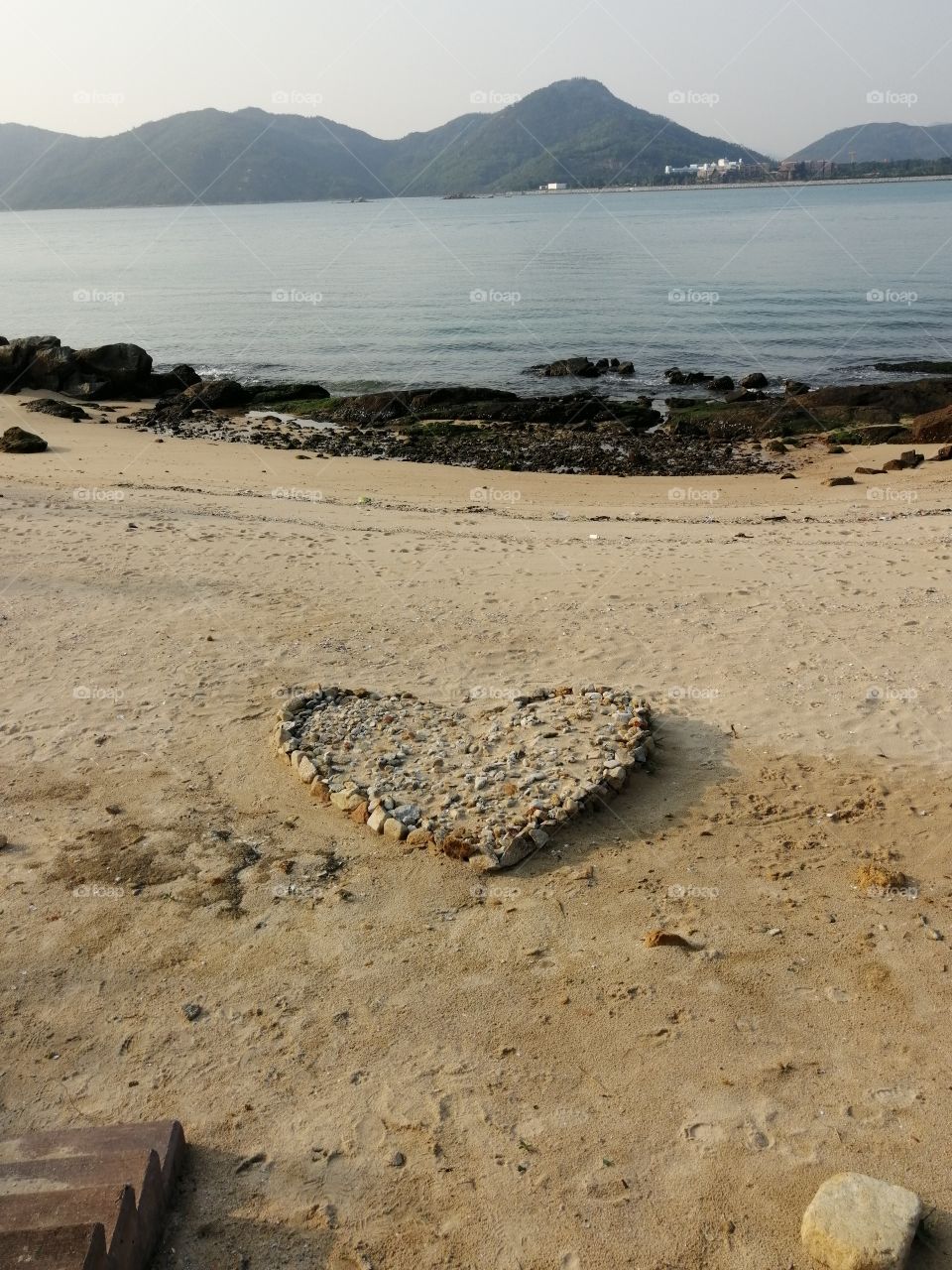 Heart of stones upon the beach in beauty bathed with warmth and love. Each a treasure gathered by careful hands.