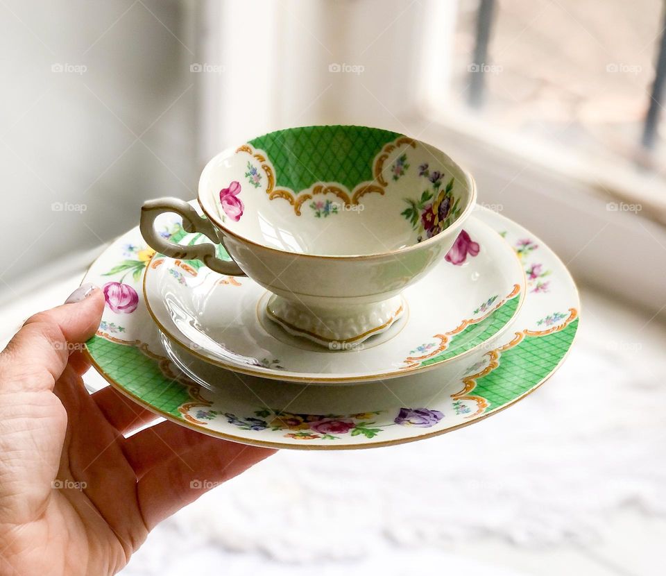 Old porcelain tea set with retro floral ornament