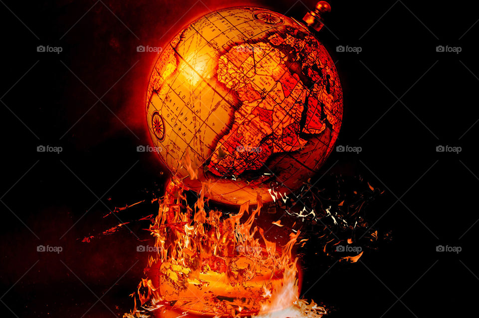 Globe on fire symbolizes apocalypse, global catastrophe