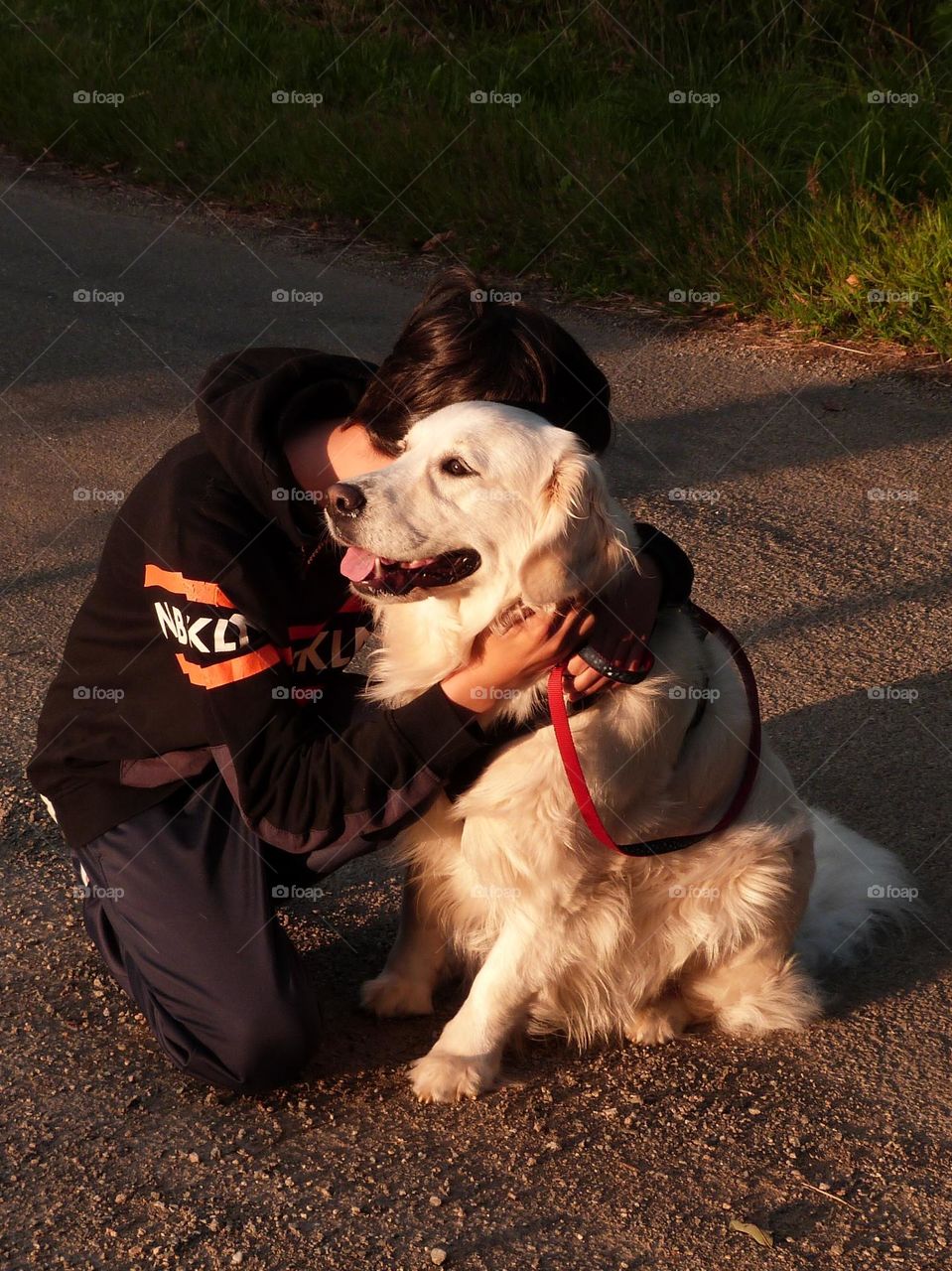 Walking your dog at sunset and taking the opportunity to give him a hug, it's a glimmer moment