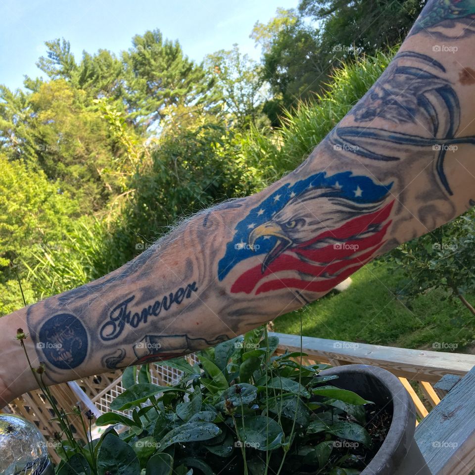 Mans tattoo of sleeve showing inside of arm.
