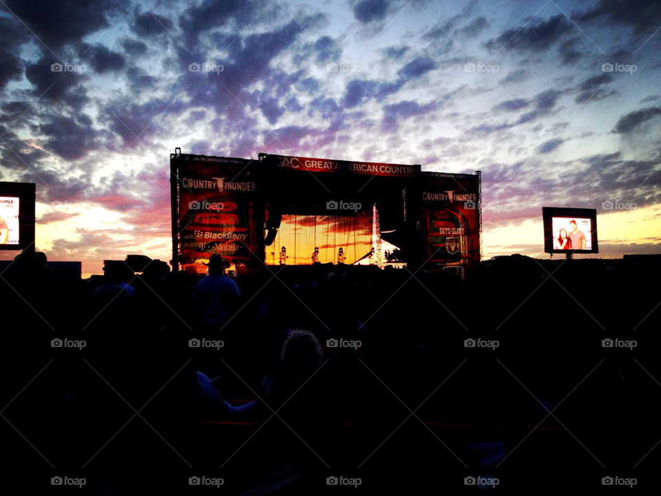 Country thunder stage at sunset.