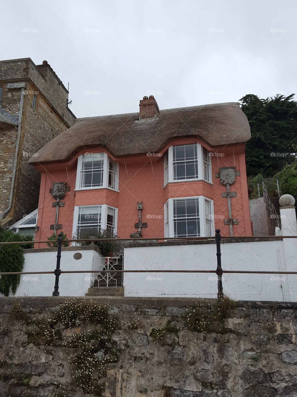 pink thached house