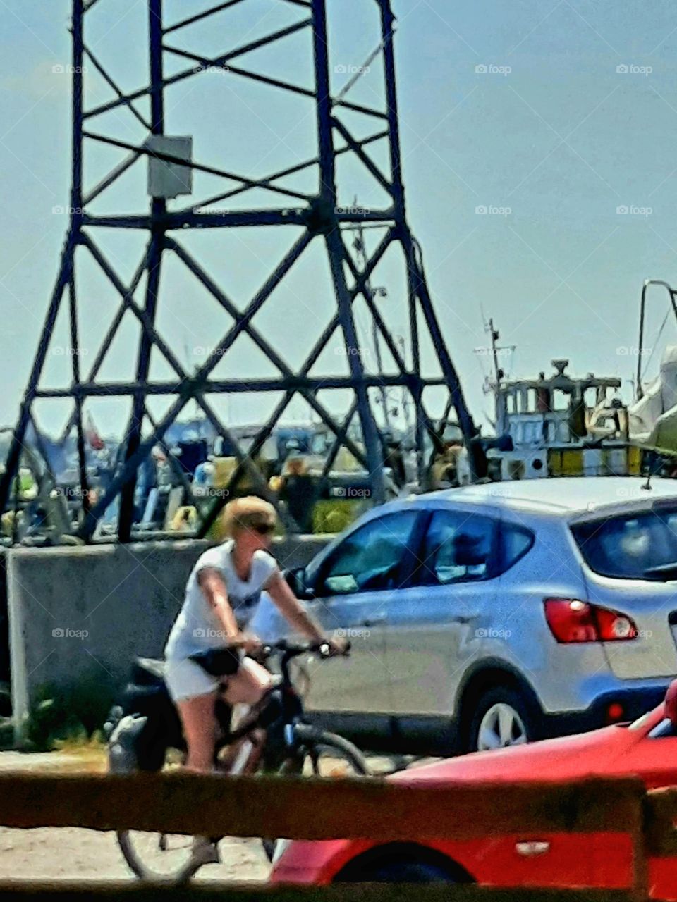 woman on a bike in old fishermen's port