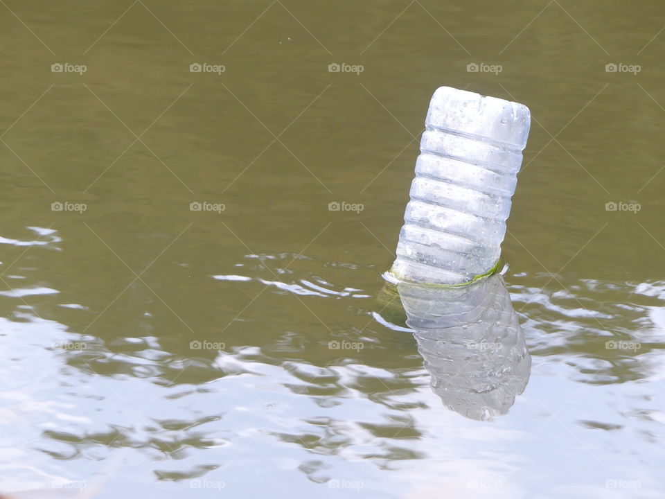 bottle in water
