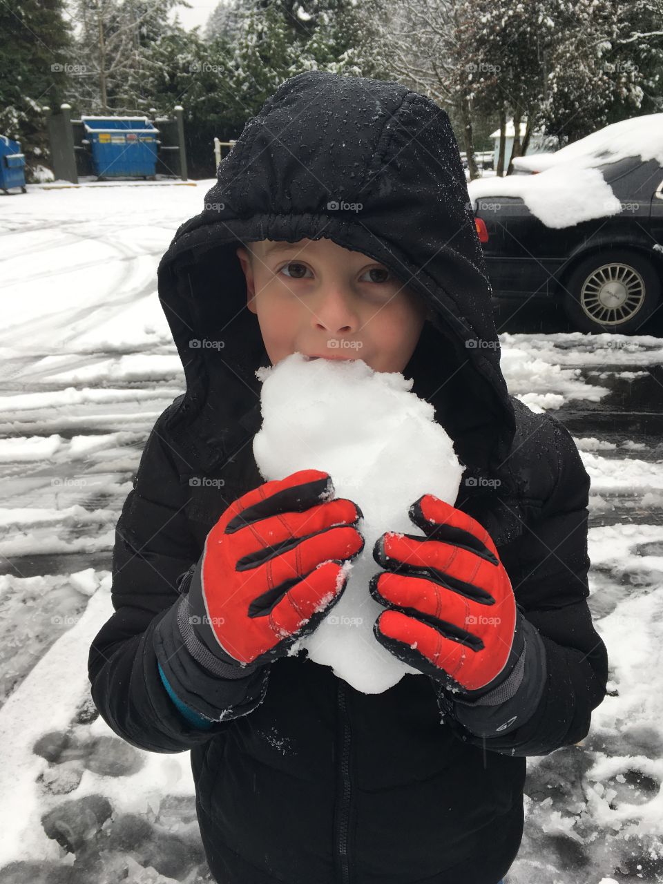 boy eating snow