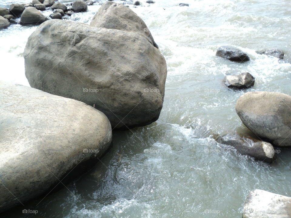 photos of river water flow with rocks