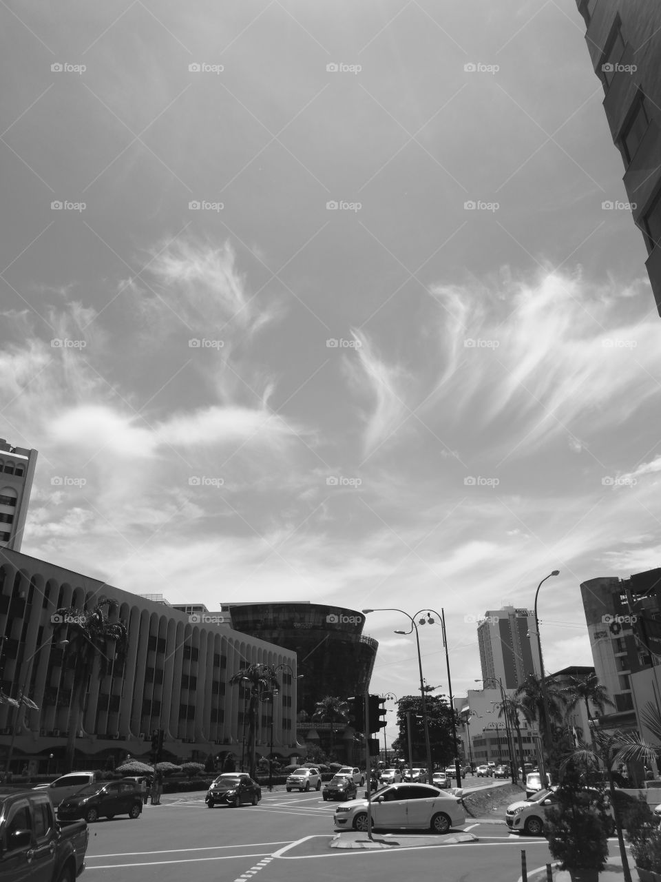 City, traffic and the sky in mono