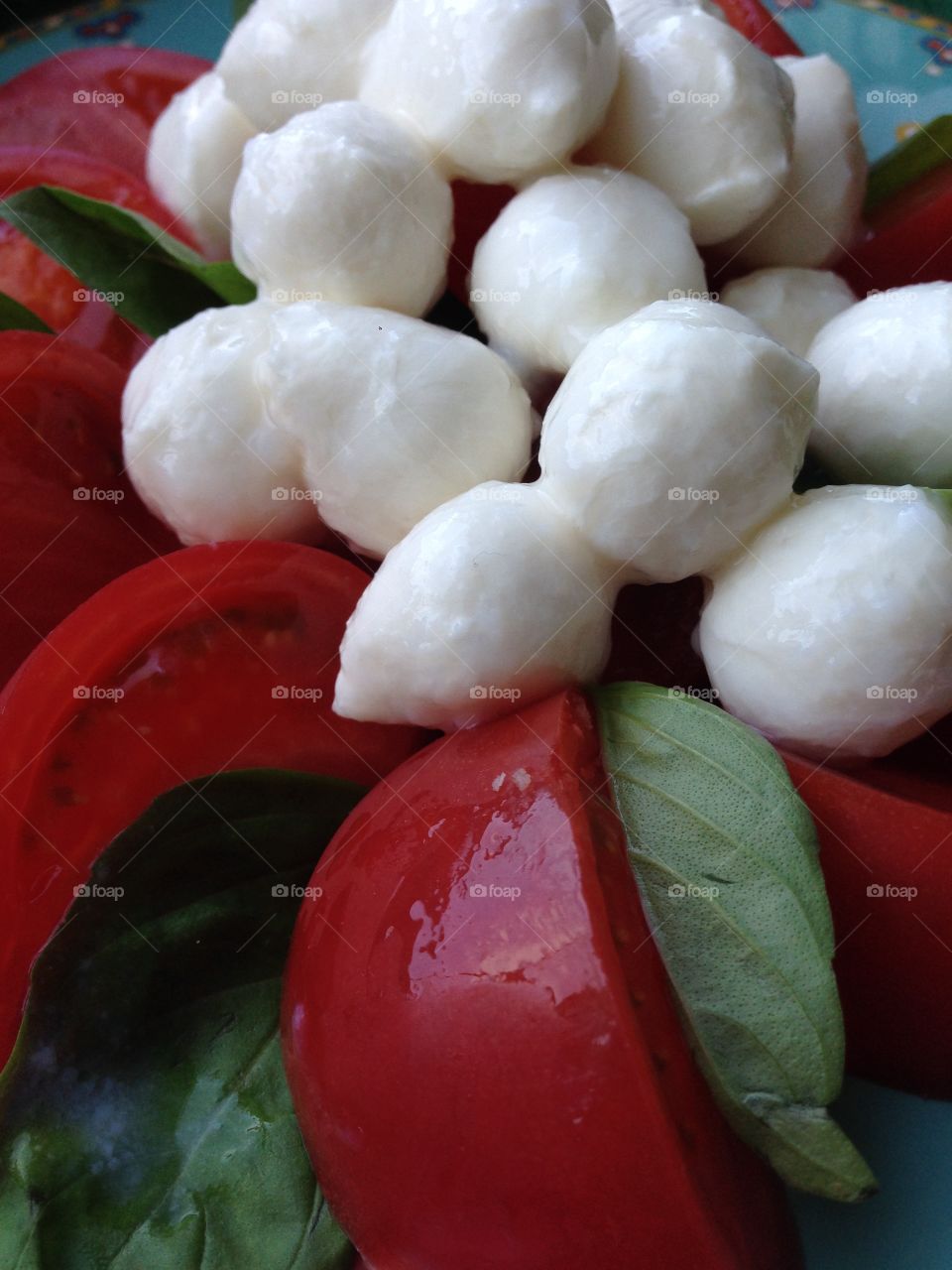 Close-up of mozzarella balls and tomatoes