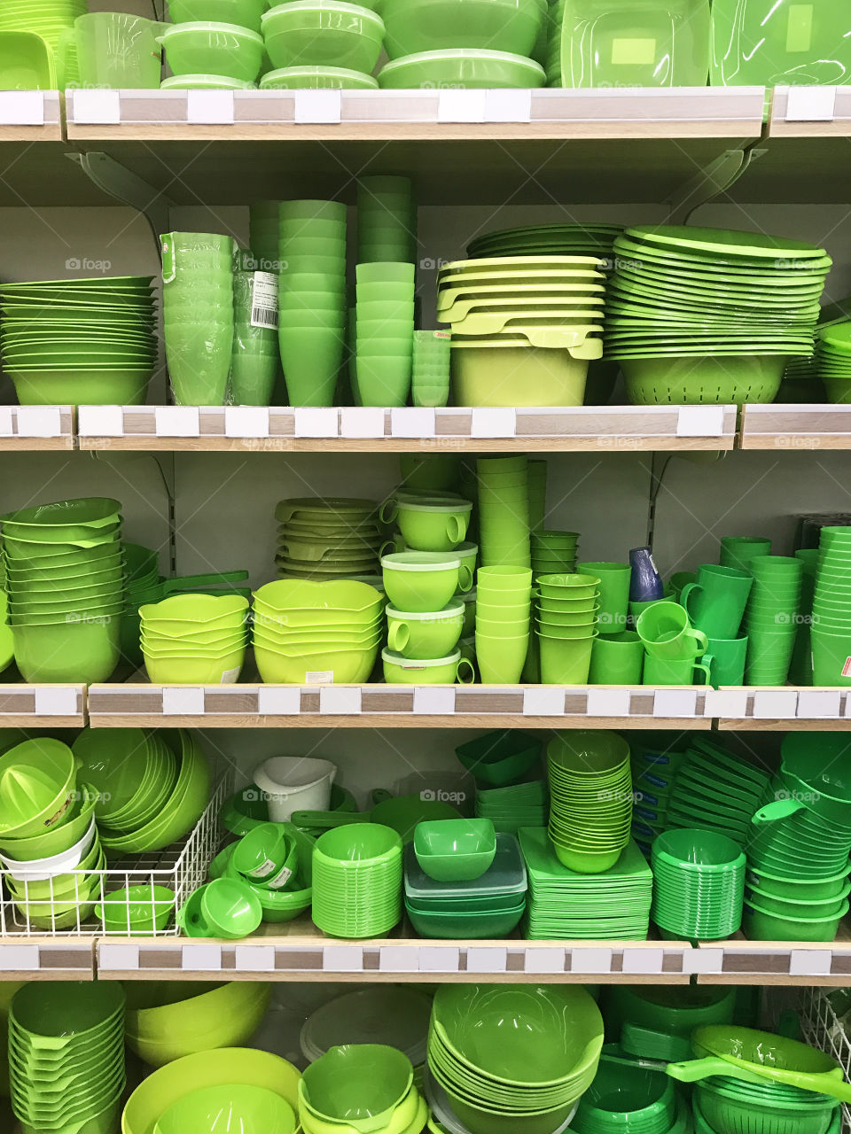 Beautiful green dishes on a shelves