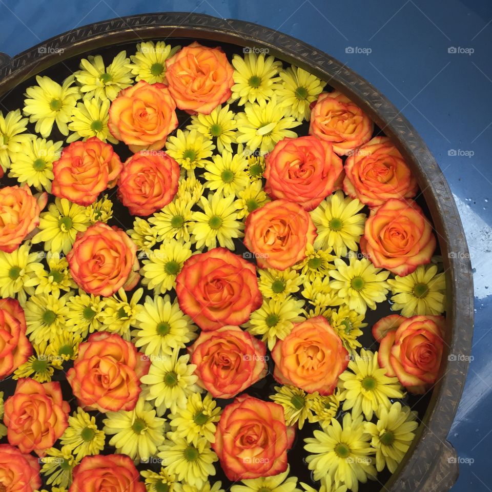 Bowl of flowers in welcome area of Thai restaurant 