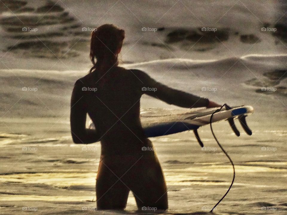 California Surfer Girl. Attractive Fit Woman In The Ocean With Her Surfboard
