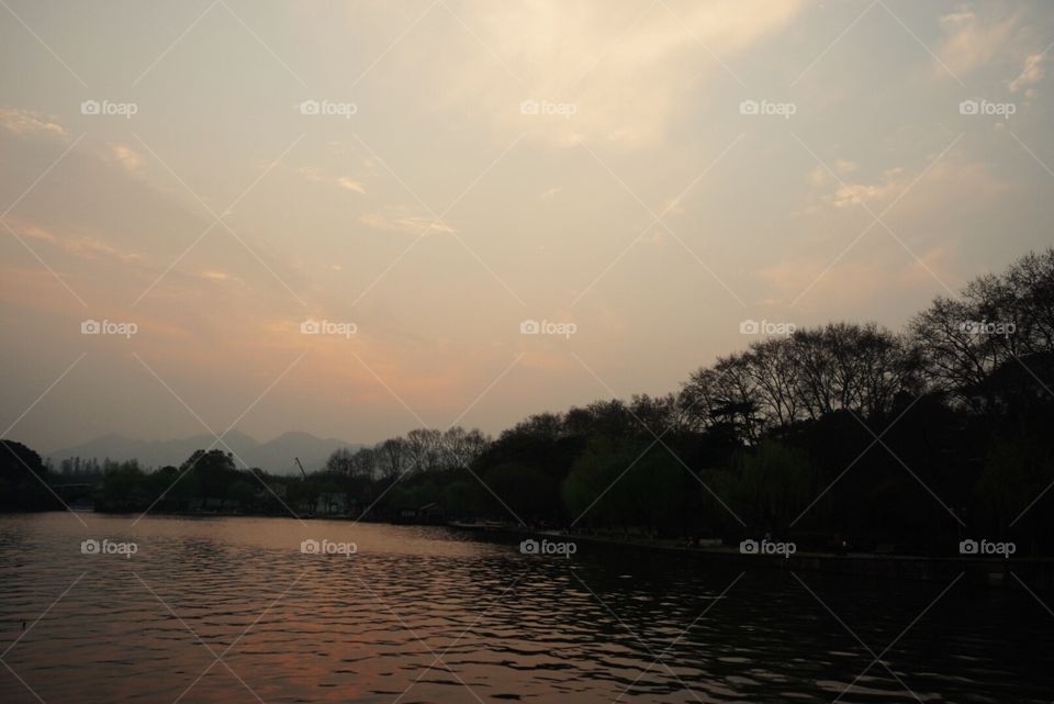 Sunset of west lake, one of the best jogging place, Hangzhou. A famous story was "born" here - The Legend of White Snake.