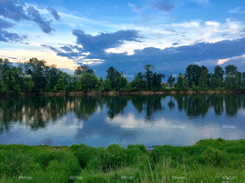 Reflection Channel. Trees and clouds reflecting in the Multnomah Channel near Scappoose, Oregon.