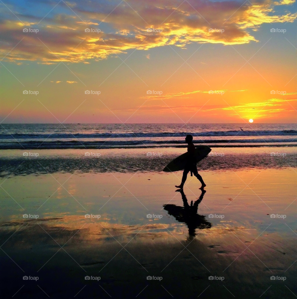 sunset clouds reflection surfing by jayanta
