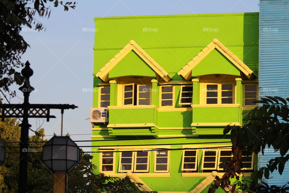 Colourfully colourful lime green house at Chiang Mai Thailand - January 2016
